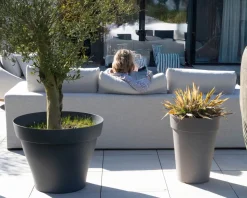Canapé d'extérieur ultra confort en tissu beige chiné et coussins décos 