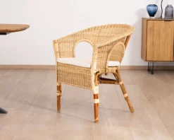 Elégant petit fauteuil en rotin tressé avec assise tissu 