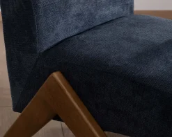 Fauteuil rétro tissu bleu foncé avec pieds bois boomerang "Tolga"