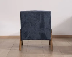 Fauteuil rétro tissu bleu foncé avec pieds bois boomerang 