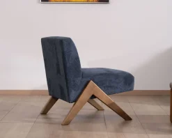 Fauteuil rétro tissu bleu foncé avec pieds bois boomerang 