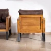 Fauteuil style club en teck et tissu aspect cuir "Roster"