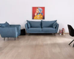 Grand fauteuil cosy en tissu bleu et pieds en métal noir "Hasting"